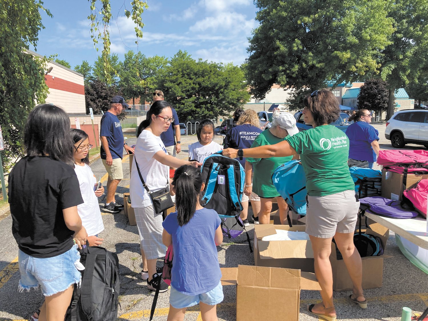 STOP ON BY: In addition to the drive-by option, families could walk in and receive a backpack at the Cranston location. (Herald photo)