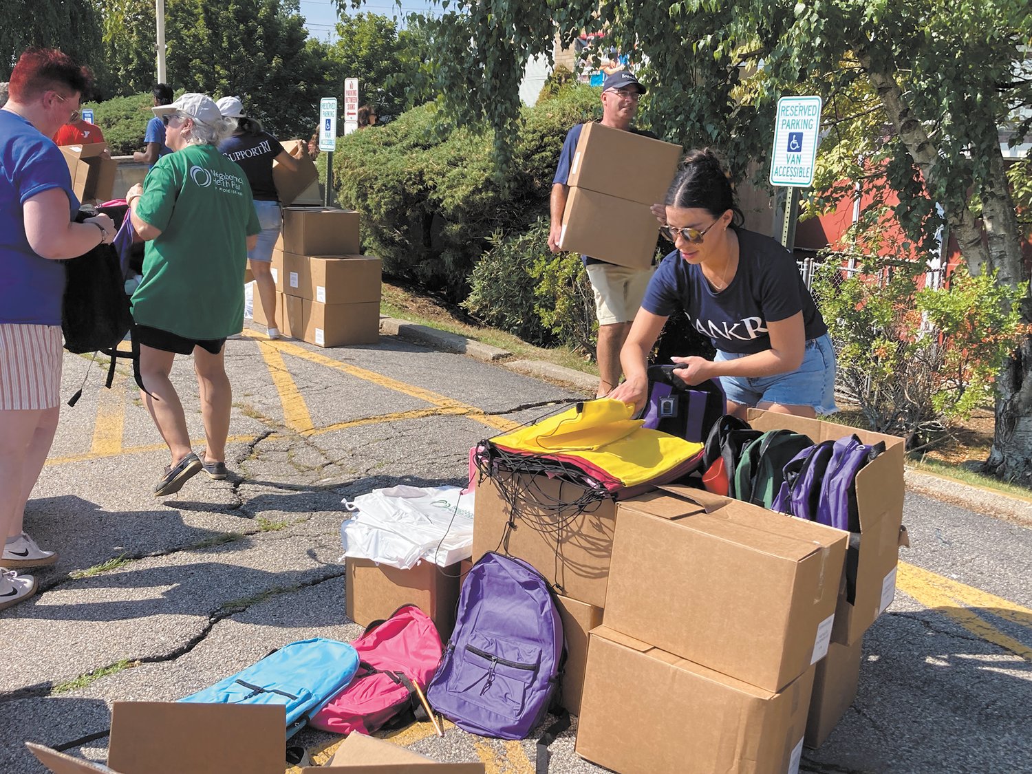 FILLING THEM WITH SUPPLIES: Backpacks were filled with pens, pencils, highlighters, notebooks, folders, a pencil sharpener and more. (Herald photo)