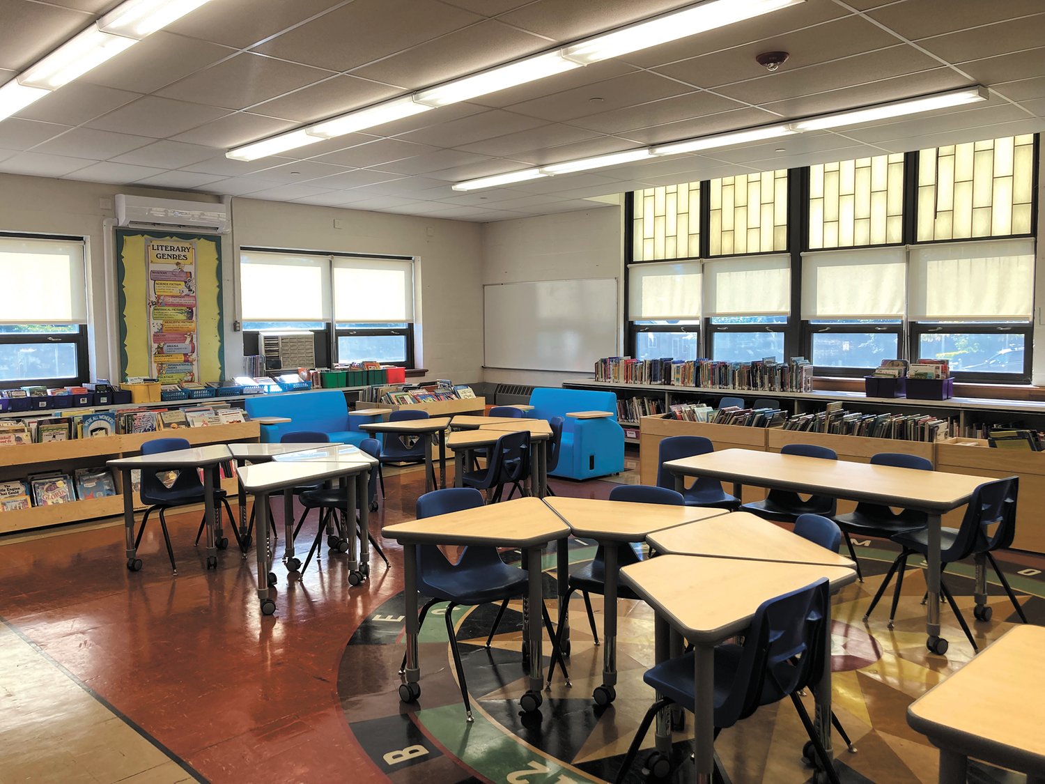 NEW ADDITIONS: Woodridge Elementary’ s 21st century library space includes four rectangular tables, 12 mobile desks, two learners' couches, six mobile browsers, nine bookshelves and a nook with three seats. (Herald photo