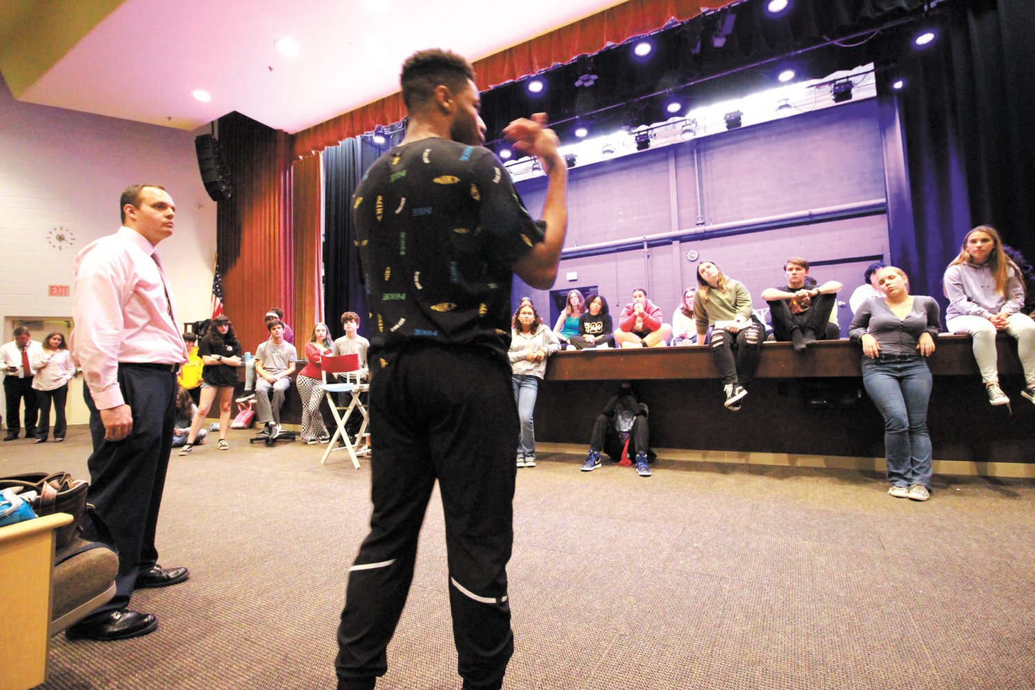 SCOOP ON BROADWAY: Pilgrim graduate Michael Harmon describes what it’s like to be cast in the Broadway MJ the Musical to the Pilgrim Players. Looking on is English teacher and drama director at the school, Richard Denningham.