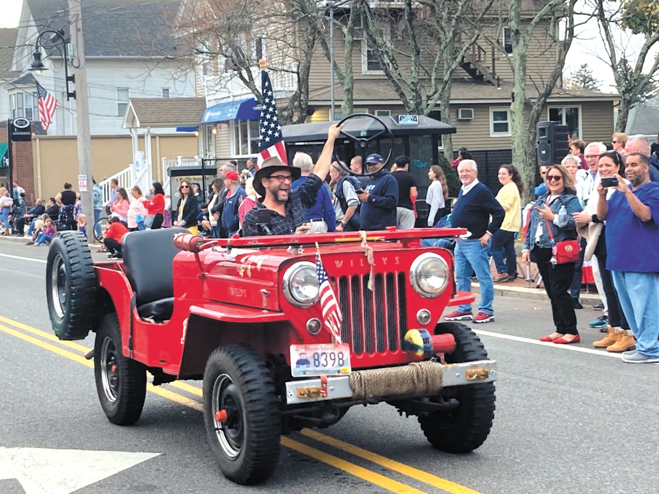 LOOK MA NO HANDS…OR WHEEL: Friday’s parade featured a variety of antique cars, fire trucks and military vehicles. Toward the end of the parade individuals were having fun honking car horns and – in one case – removing the steering wheel from the car.