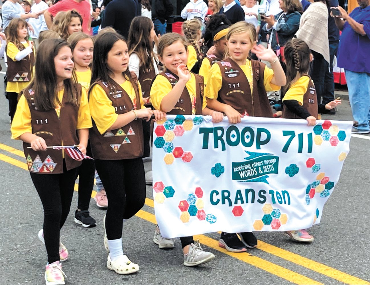 GIRL SCOUTS: Cranston’s Troop 711 participated in this past Friday’s parade and waved to those in the crowd. (Herald photos)