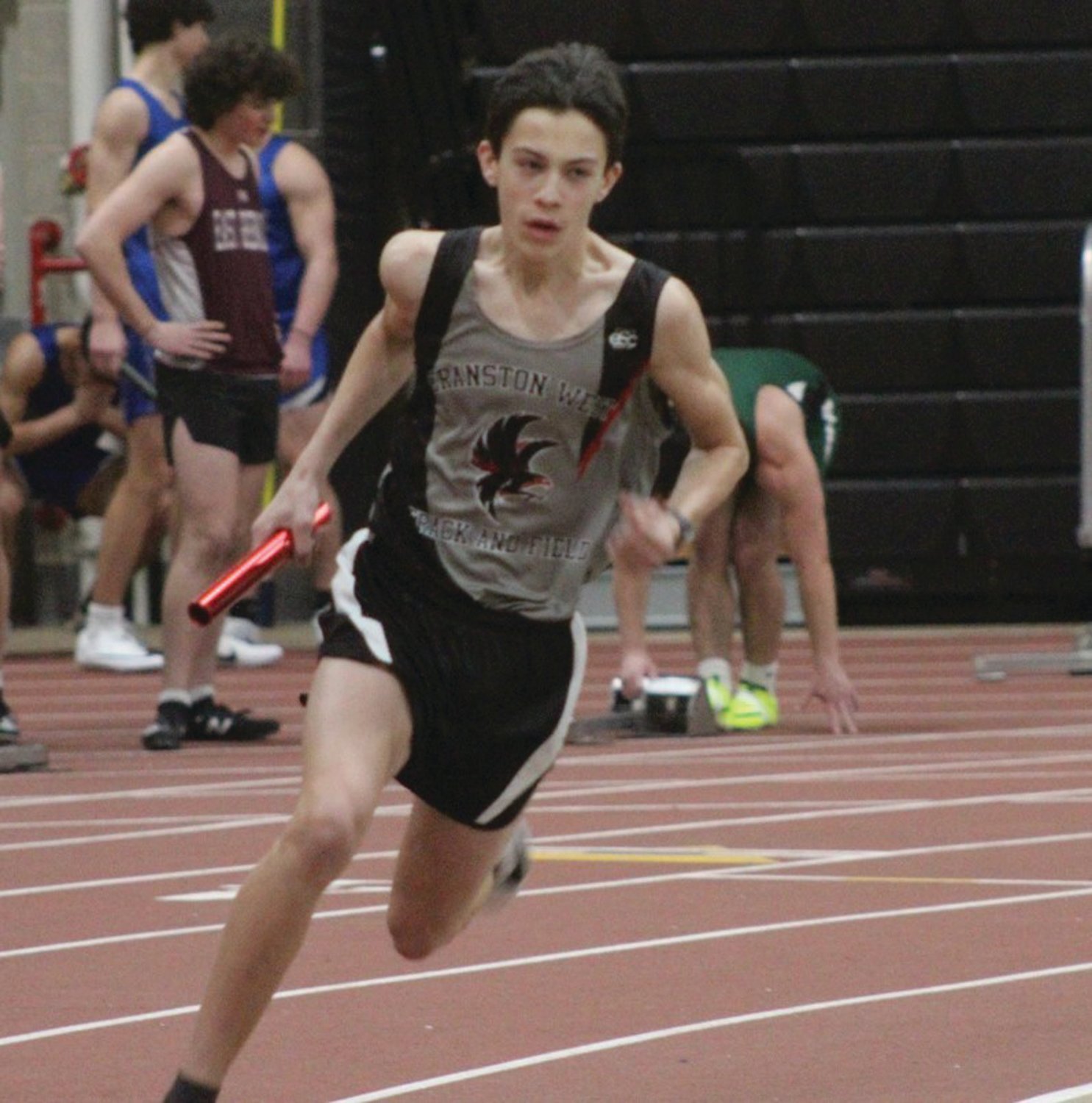 RELAY RACE: West’s Ryan Stoloff carries the baton in a relay.