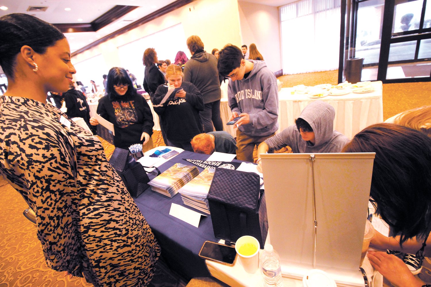 POPULAR STOP: The URI table was a busy venue during the college fair hosted by National TRiO Day.