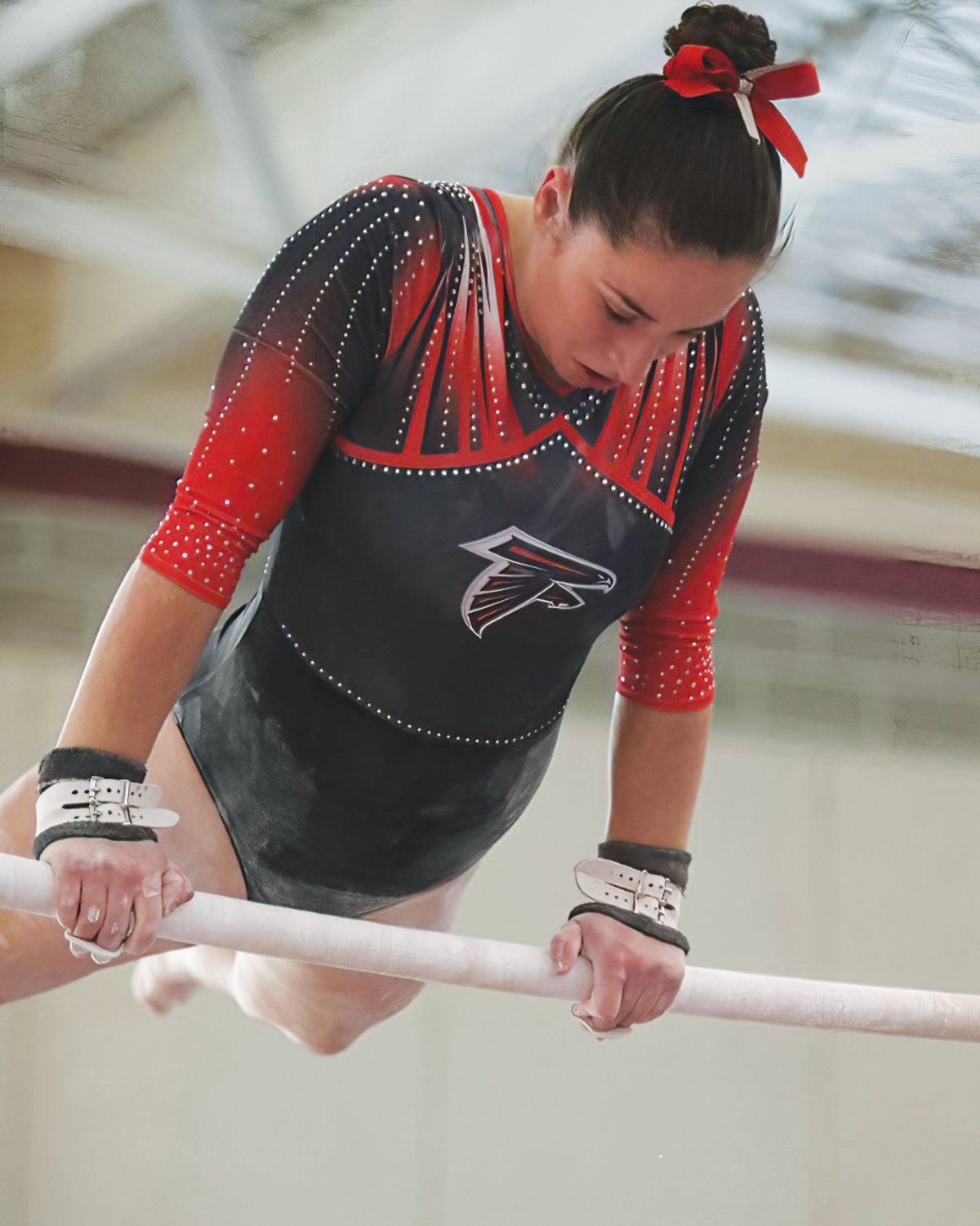 NEW ENGLAND CHAMP: Brooke Anderson competes on the bars. (Photos by Mike Zawistoski)