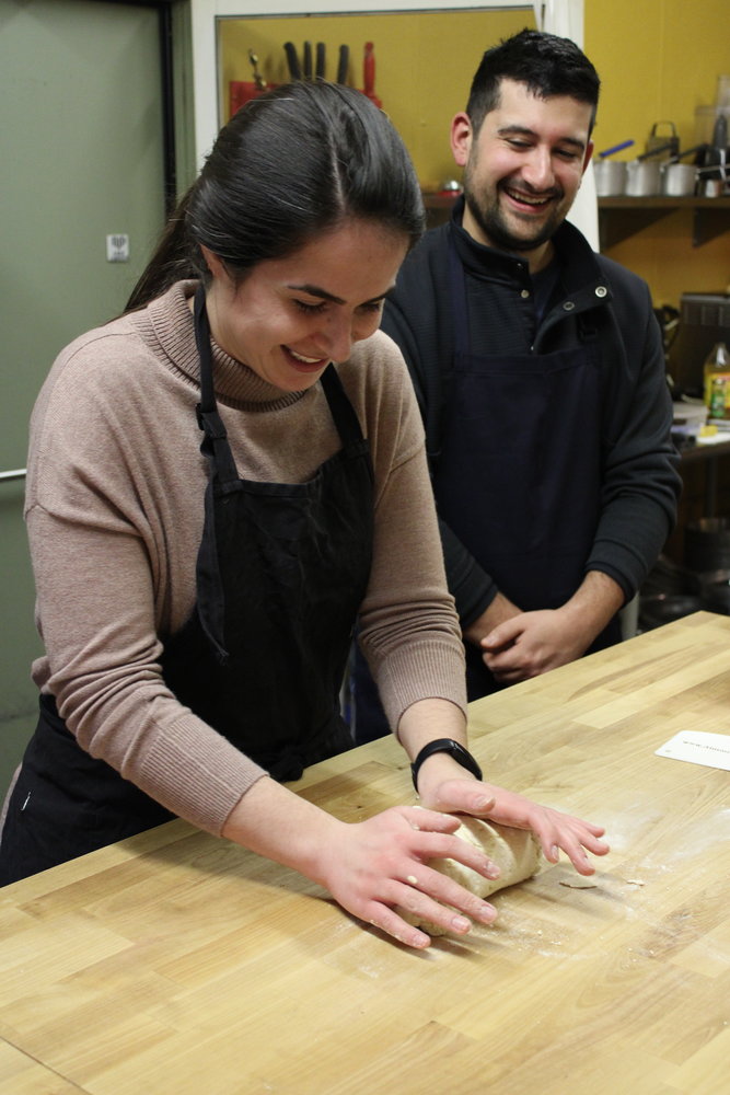 KNEAD IT LIKE YOU MEAN IT: Maggie and Joseph Simeone smile in excitement as the homemade gnocchi dough comes together.