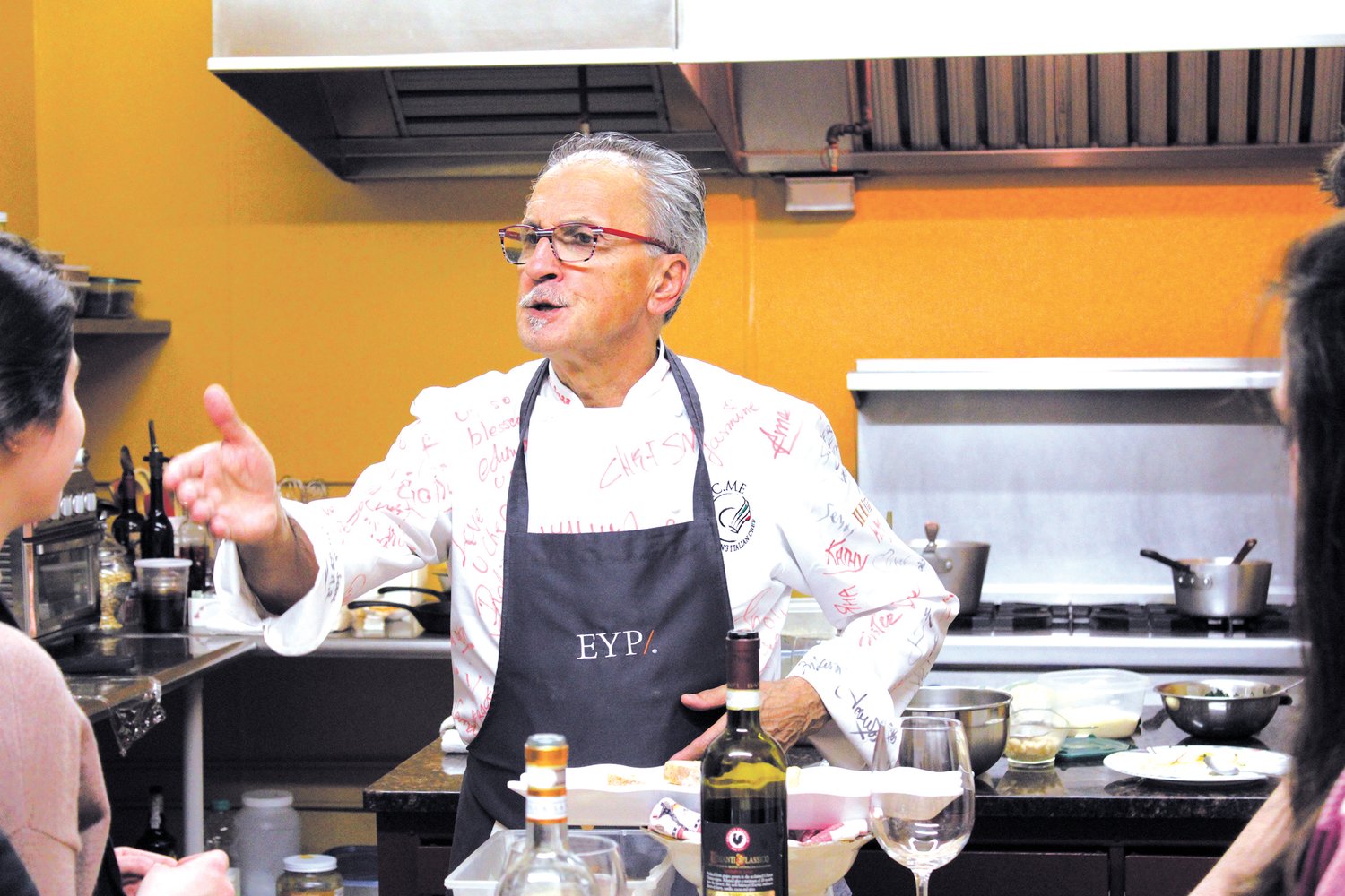 YEARS OF EXPERIENCE: Chef Walter tells the class of how he came to America as a soccer player before moving on to work in a restaurant and eventually being invited to cook at the winter olympics.