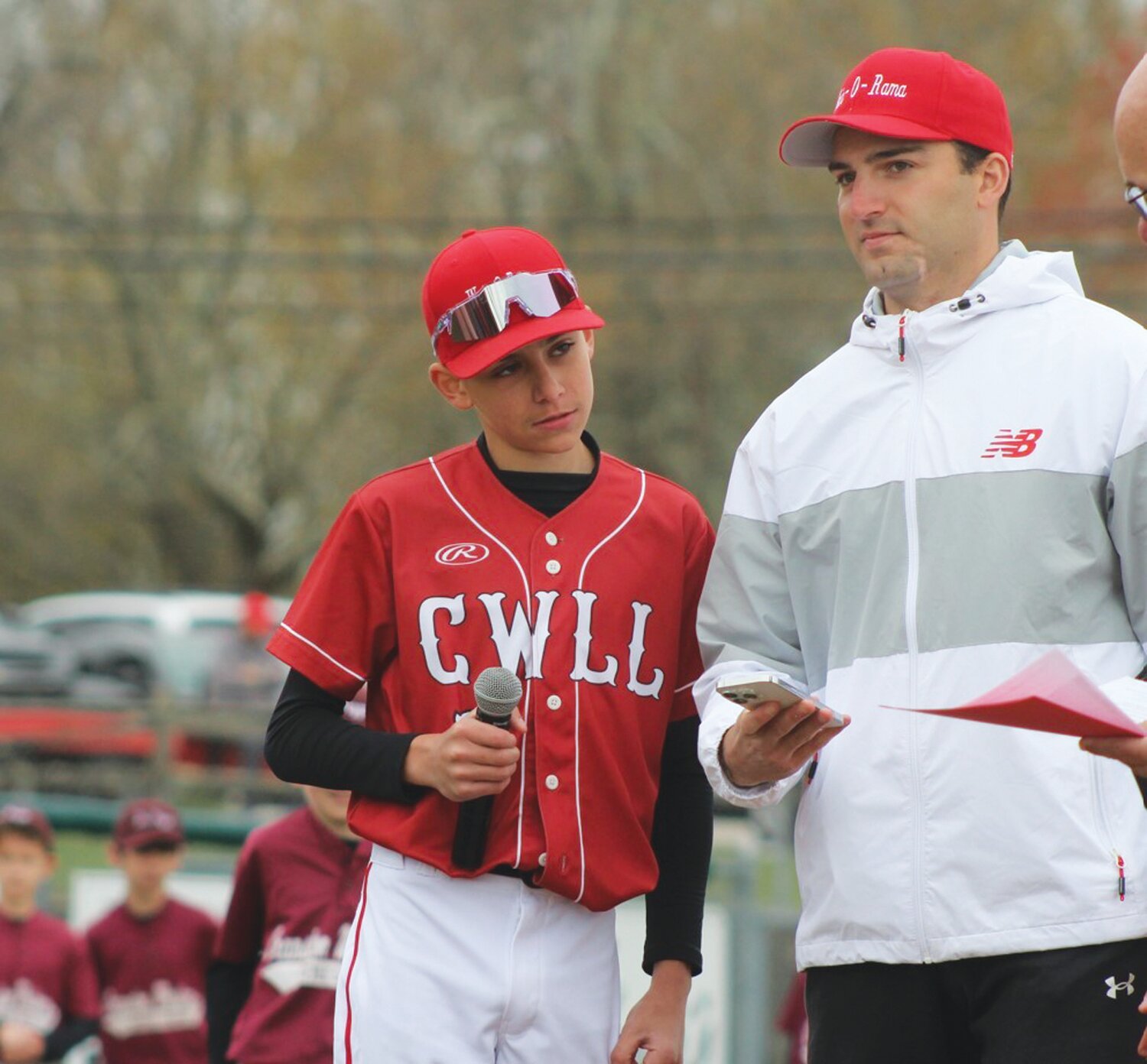 LEADING THE CHARGE: Dylan Phillips reads the Little League pledge prior to Opening Day.