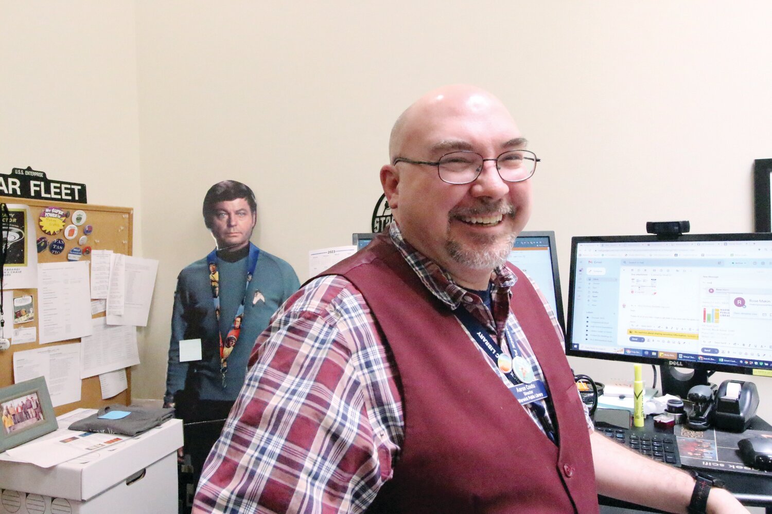 TREK FAN: Library director Aaron Coutu, as one would conclude from visiting his office, will be attired for the occasion. After all, he’s got someone watching over him.