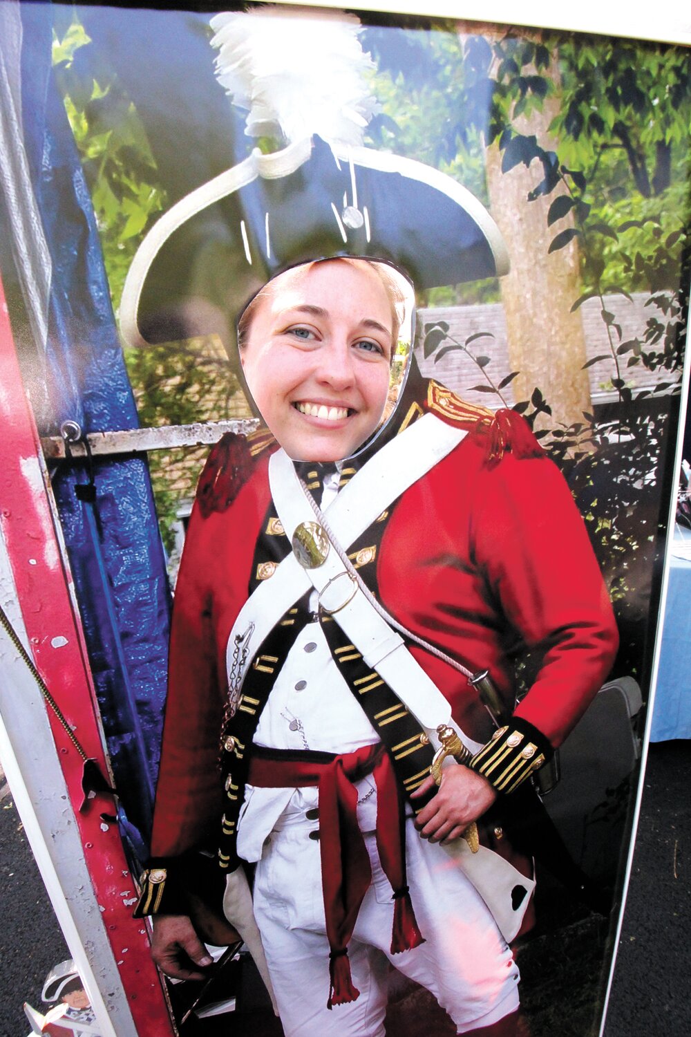 GEARED UP AND READY: Pawtuxet Rangers quartermaster Rachel Sczurek looks from a Rangers cutout that was featured at display. The Rangers have a full slate of activities as the Gaspee Days celebration commemorates wthe 251 anniversary of the British ship as she was fast aground on the shoals of Namquid Point, now Gaspee Point.