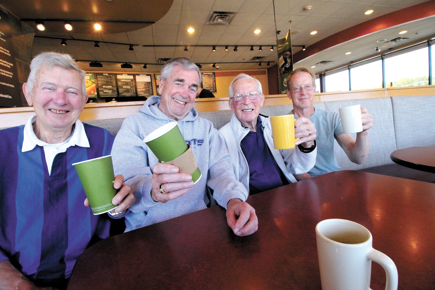 HOLDING COURT:  Bob Coker, second from right is joined by his son, Dave at right and Ed Blamires and Joseph Crowley on a recent Saturday morning for coffee following league play at Tennis Rhode Island. Bob Coker started the league soon after Toll Gate High opened in the early 1970s and continued playing up until a couple of years ago.  (Warwick Beacon photo)
