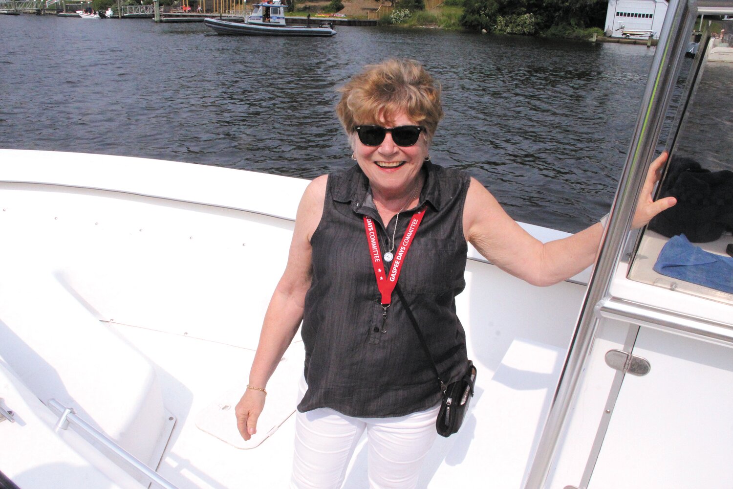 READY FOR A BlazE:  Gaspee Days parade chair Janel Russell accompanied Warwick harbormasters as they set off Sunday to set fire to the Gaspee in Pawtuxet Cove. She forgot to bring matches, but the harbormasters had flares. (Cranston Herald photo)