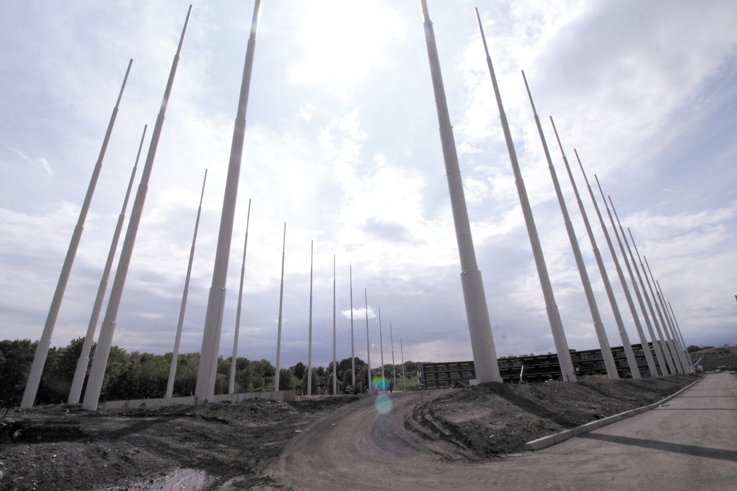 YOU WONT’T BE ABLE TO TOP THAT: Poles that will soon hold netting stretch out from the three-level platform where people will hit balls from the $40 million Top Golf under construction across from Gar den City and bordered by Route 37.