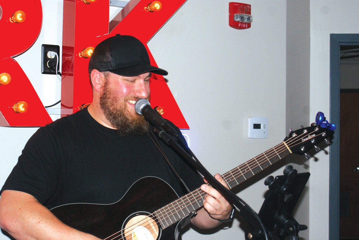 COFFEE AND A SONG: Acoustic performer Patrick Kearns entertains people in the Park Cafe.