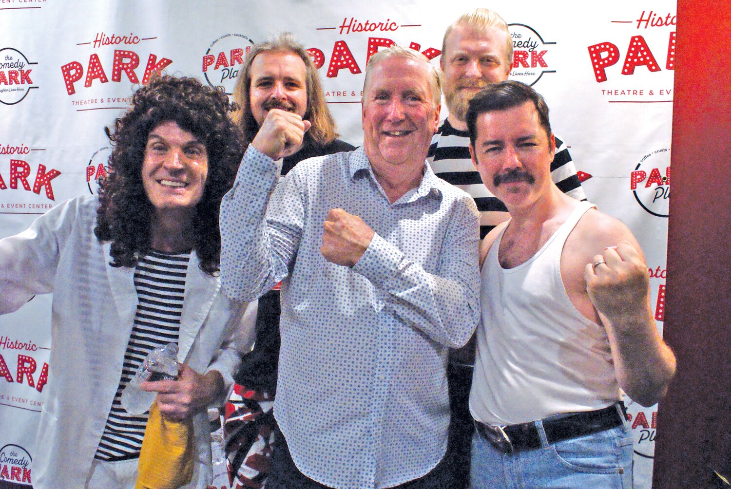 LONG LIVE YOUR MAJESTY: Members of the British band Majesty, a Queen cover band, stand with Mayor Ken Hopkins for a quick photo. Left to right: Guitarist Pete Southern, bass player Ronnie Holland, Mayor Hopkins, drummer Chris Carter and vocalist/keyboard player Rob Lea as Freddy Mercury.