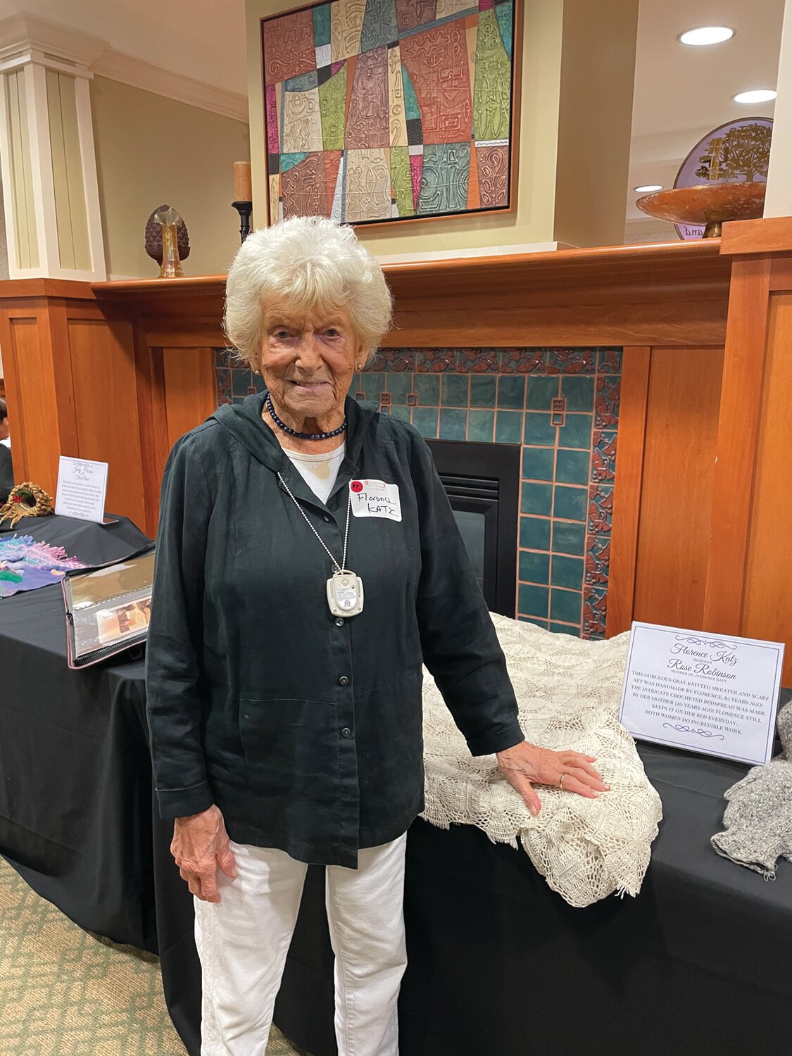 WHAT A STORY SHE HAS: 101 year old, Florence Katz from Cranston, shows off the bedspread her mother made when she was born.